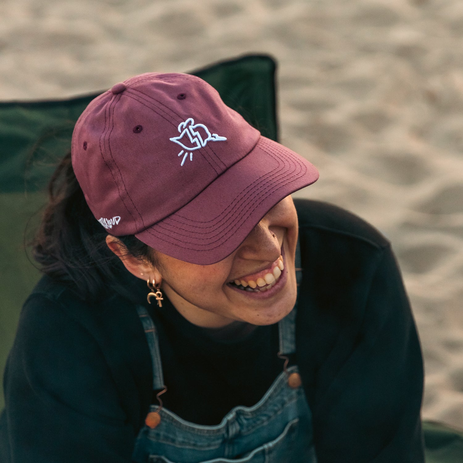 Portrait of woman wearing the Cat & Cloud Summerr mom hat at the beach 2024